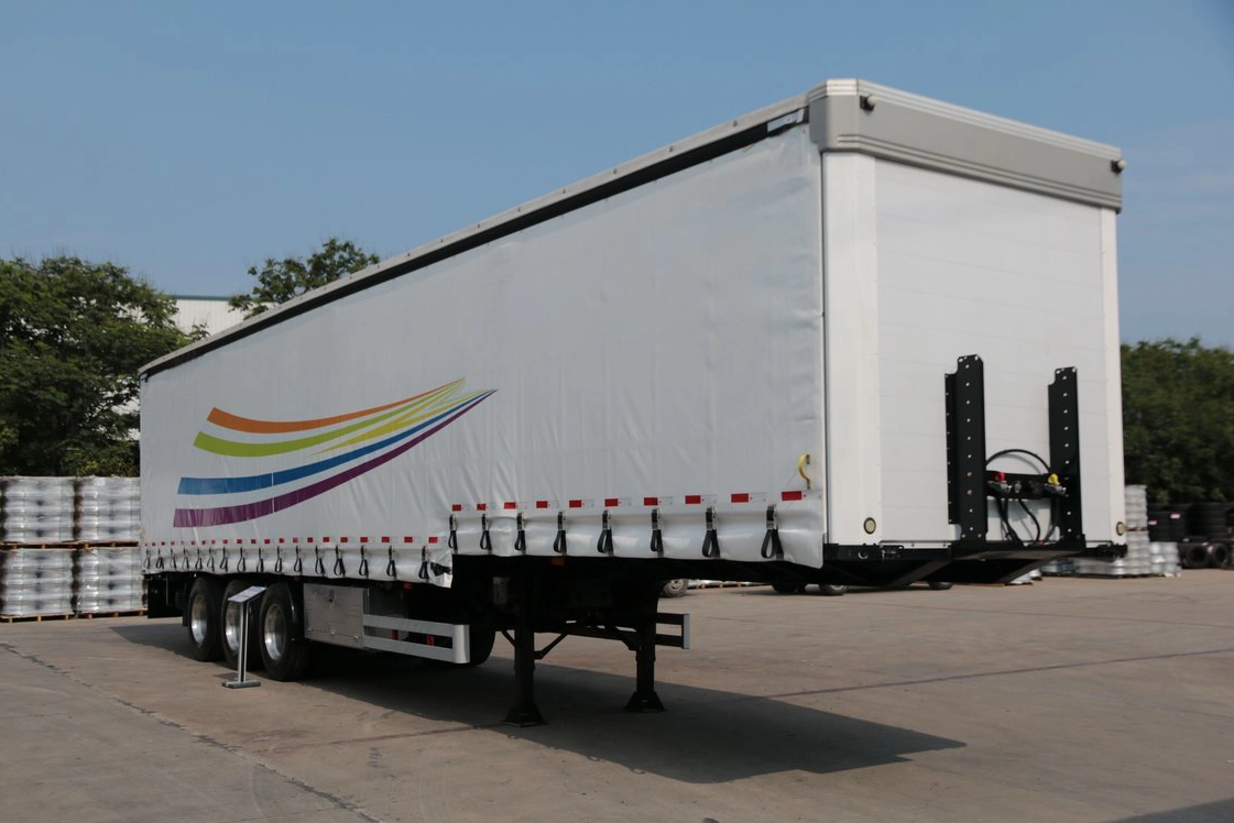 Front 45-degree view of Kales 13M Curtainsider semi-trailer featuring aerodynamic chamfered corners.