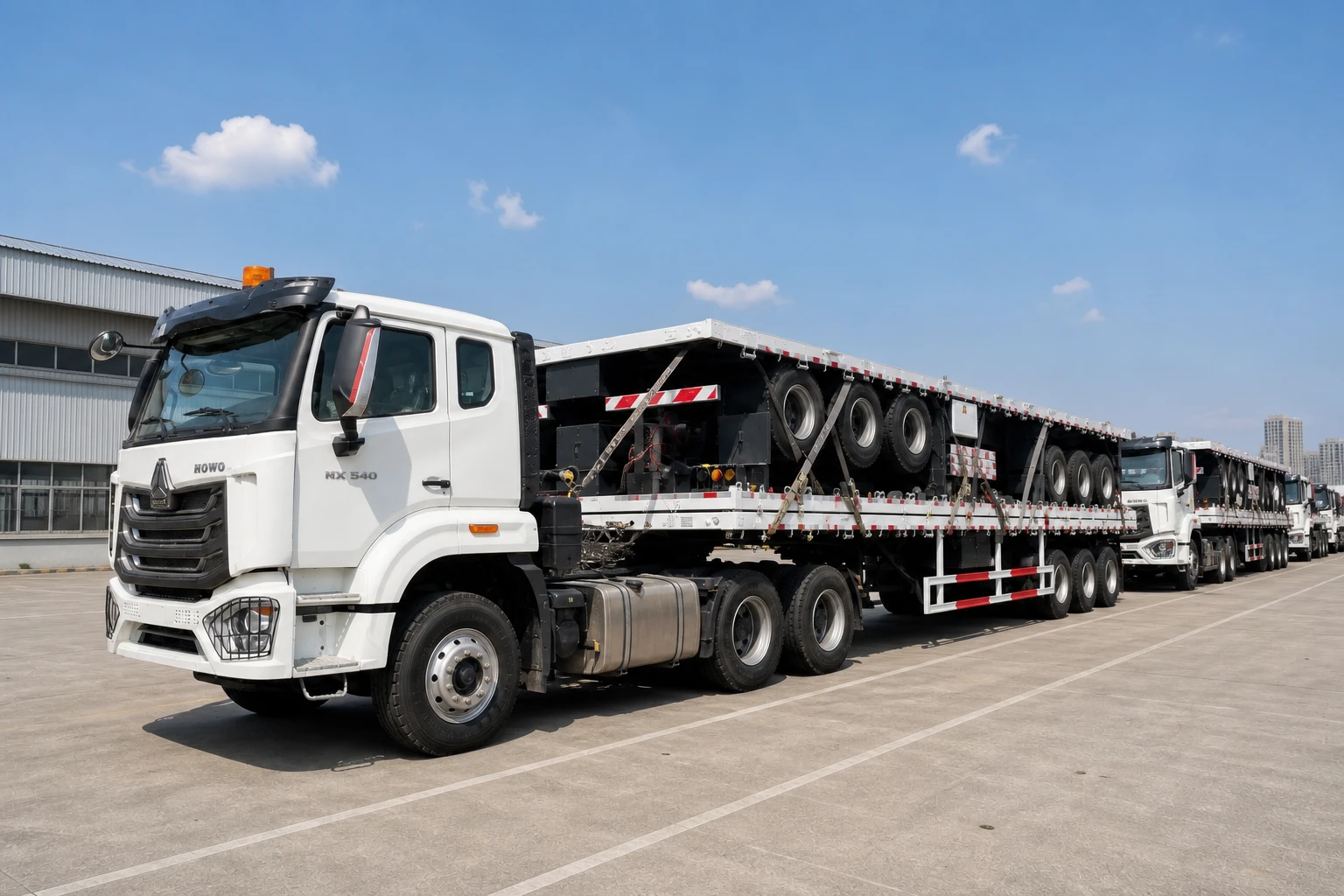 Rear-side view of a 3-axle 15m flatbed semi-trailer showing 13-ton axles and mechanical leaf-spring suspension before shipment